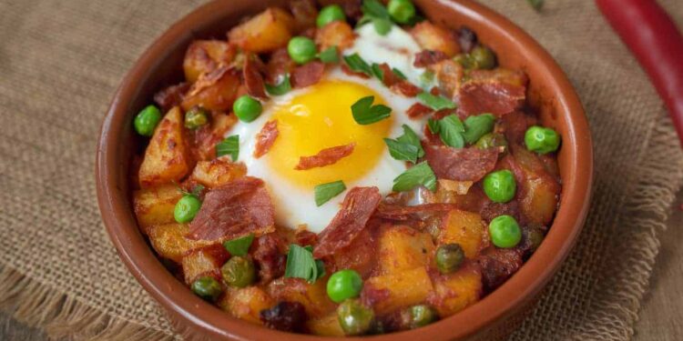 Huevos a la Flamenca (Andalusian Baked Eggs with Chorizo, Ham and Peas)